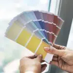 closeup of hands holding color swatch 2022 12 16 00 47 16 utc scaled 1