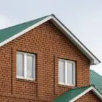 red brick house with green roof traditional europ 2022 10 24 23 40 13 utc