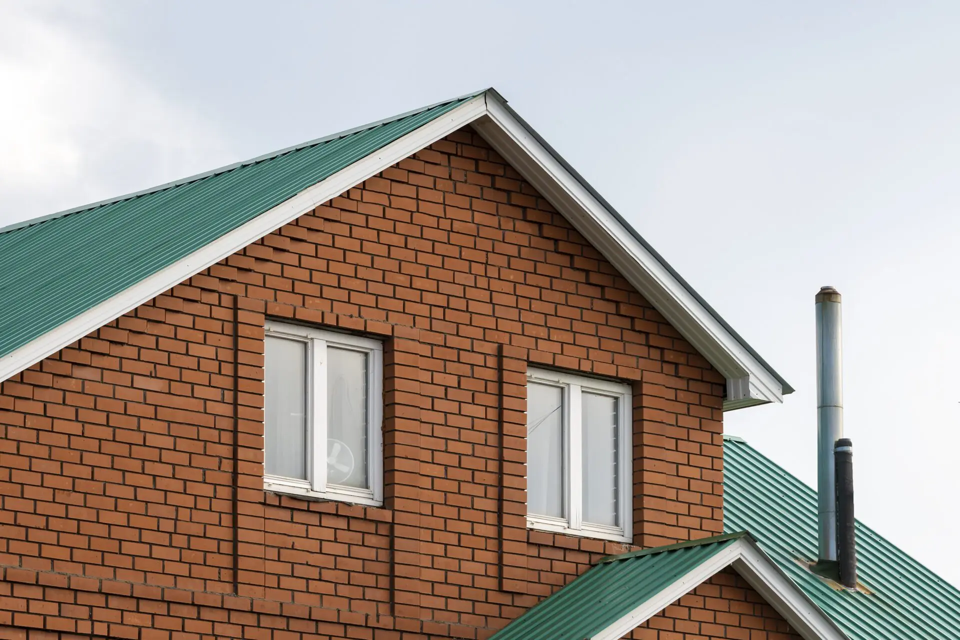 red brick house with green roof traditional europ 2022 10 24 23 40 13 utc